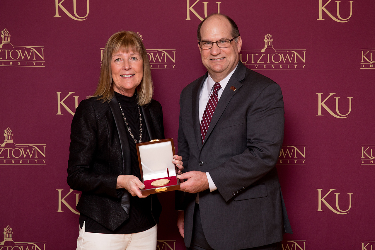 Dr. Kenneth S. Hawkinson (right) presenting Mayor Sandra Green (left) with the Kutztown University President's Medal.