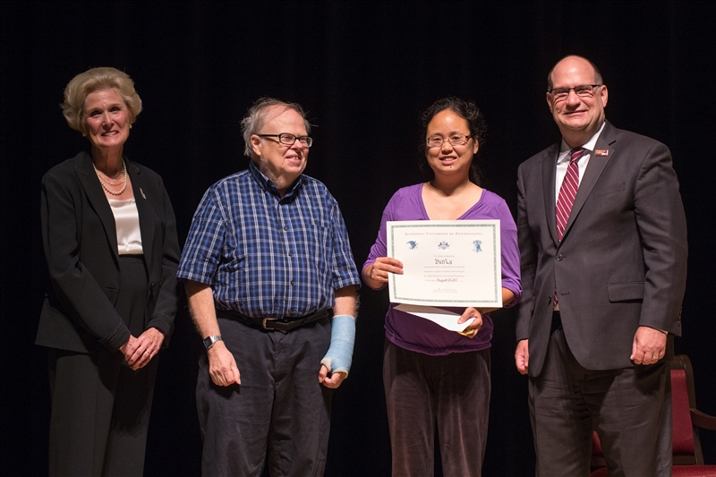 Dr. Lu being presented with the Chambliss Faculty Research Award