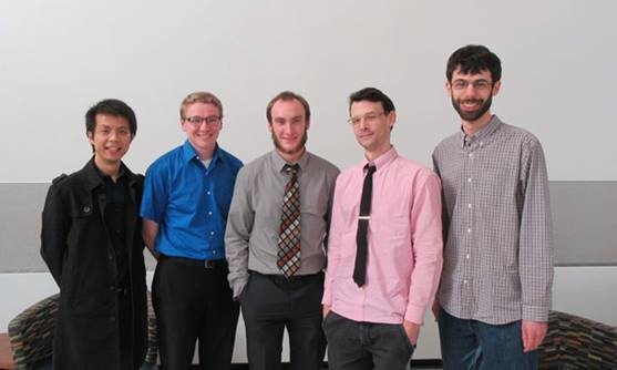 Student presenters with faculty mentors at a conference