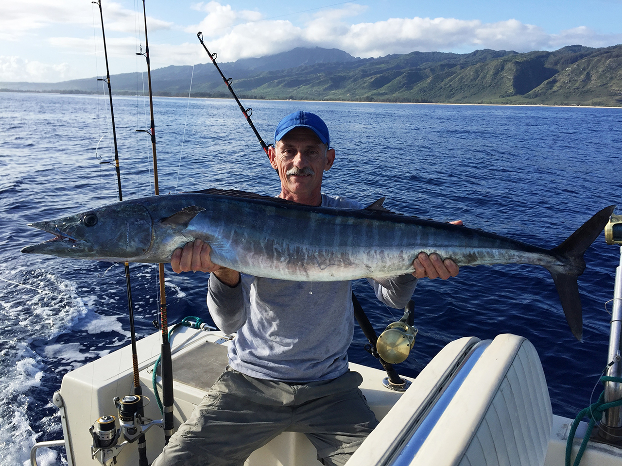 Gerry with a large wahoo fish on a boat off Hawaii
