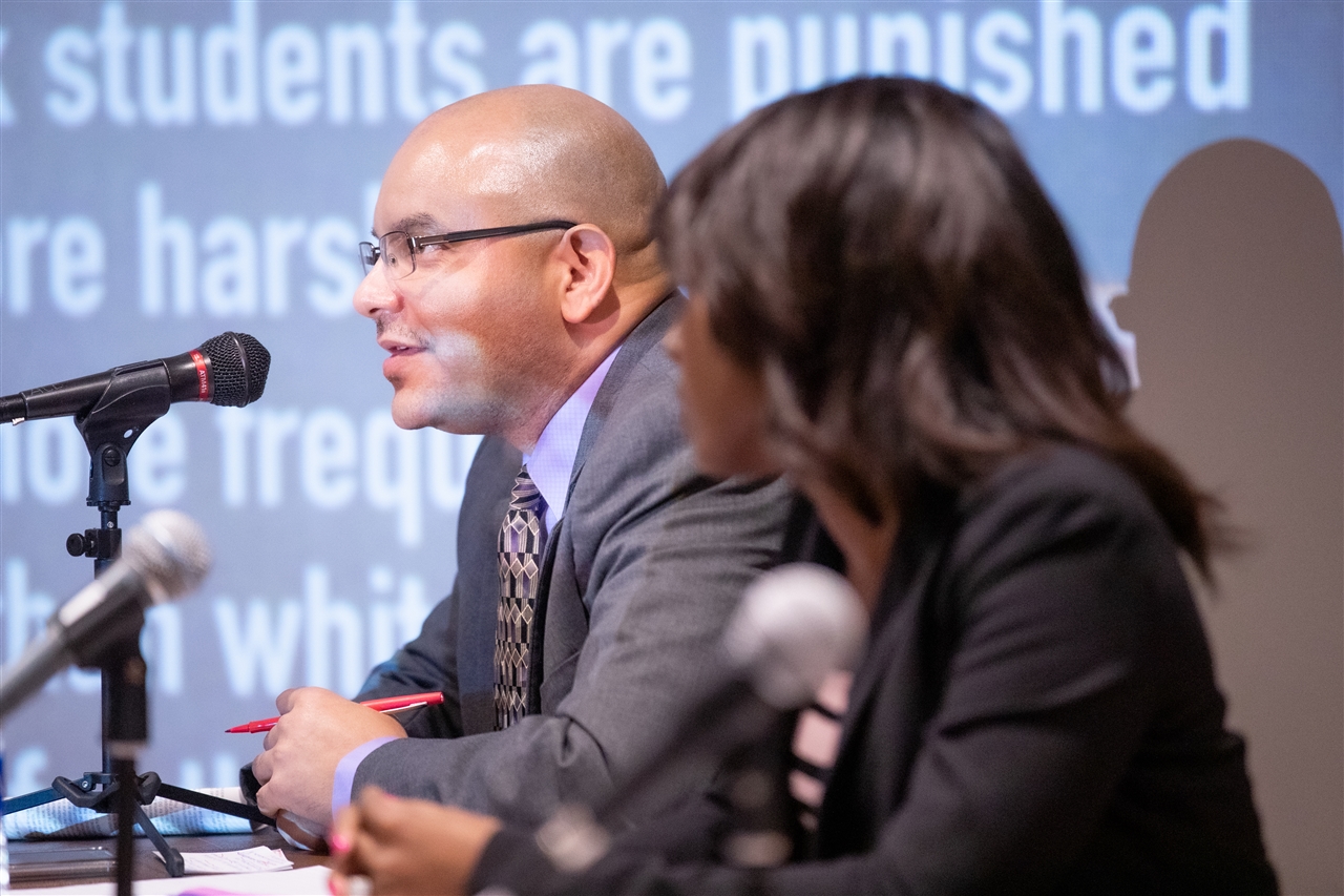 male panel member speaking at the slavery and its impact conference