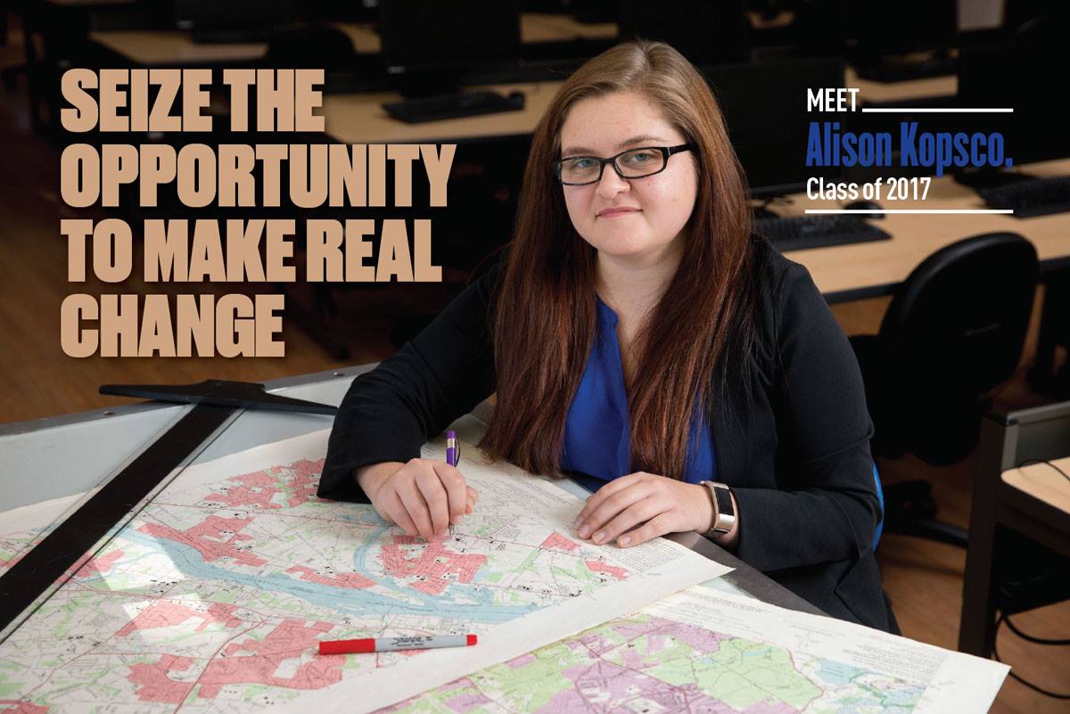 A female student tracing bylines on various maps laid out on the table in front of her. Text reads "seize the opportunity to make real change. Meet Alison Kopsco, Class of 2017."