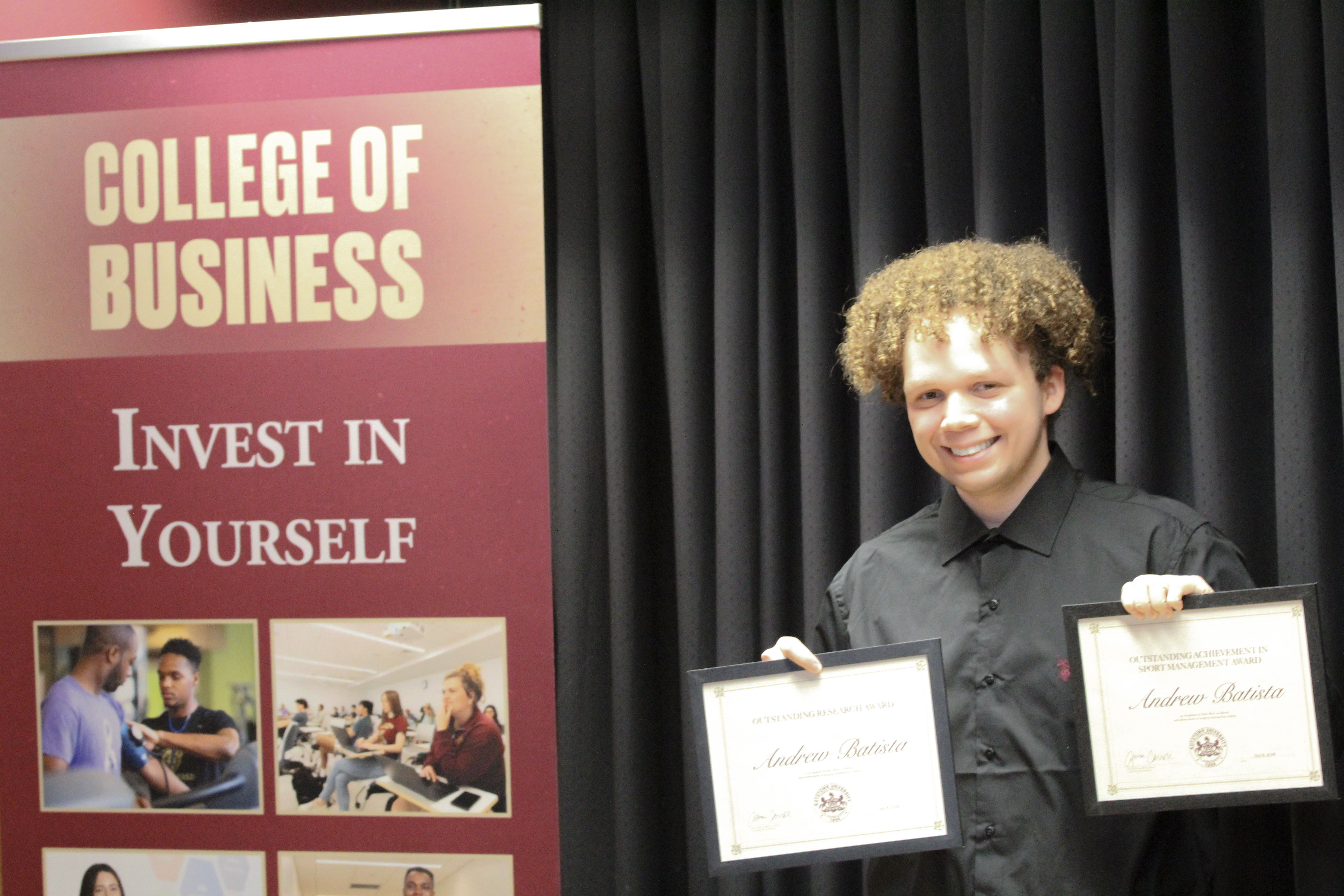 Andrew Batista with award