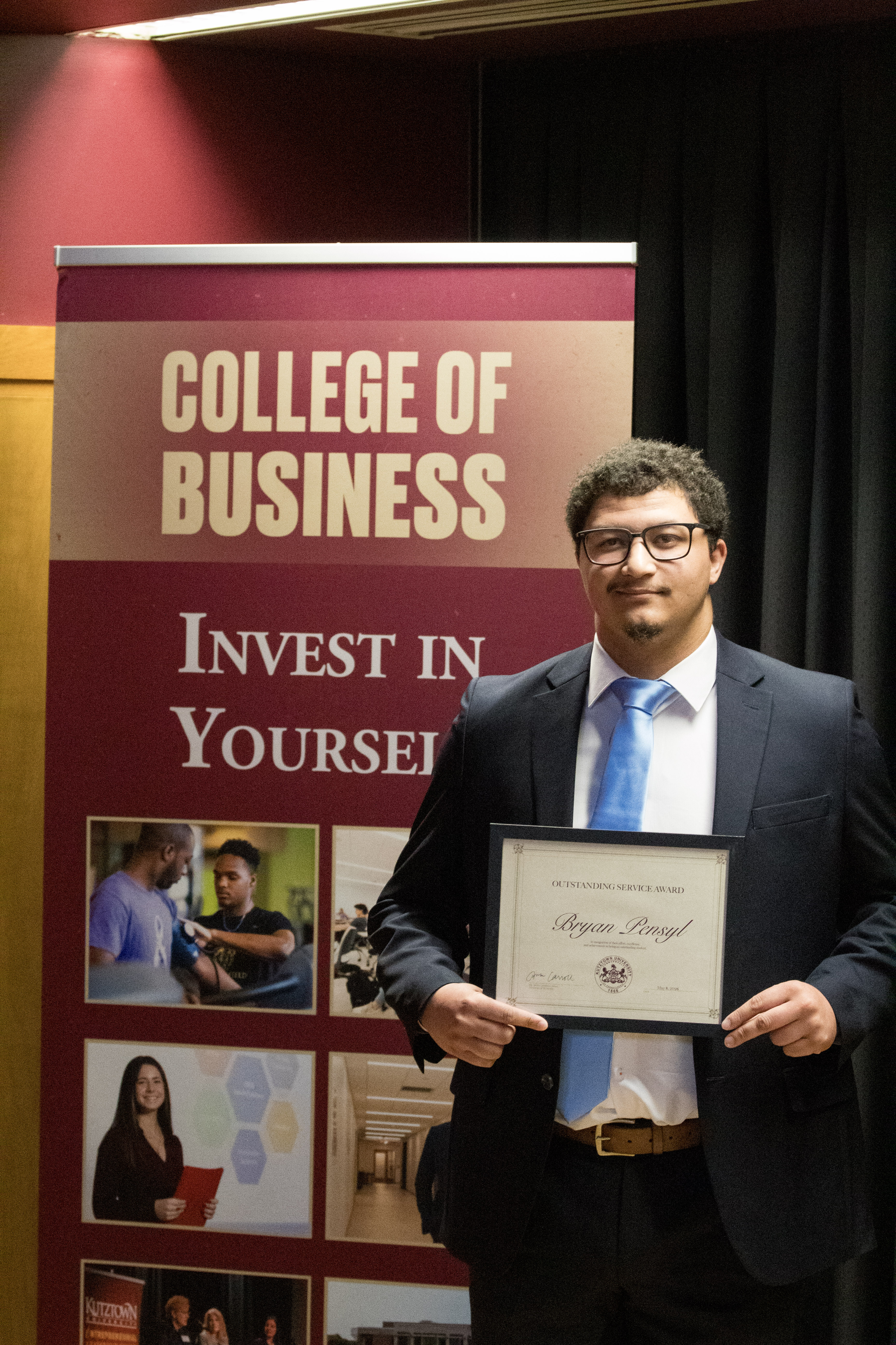 Bryan Pensyl with award