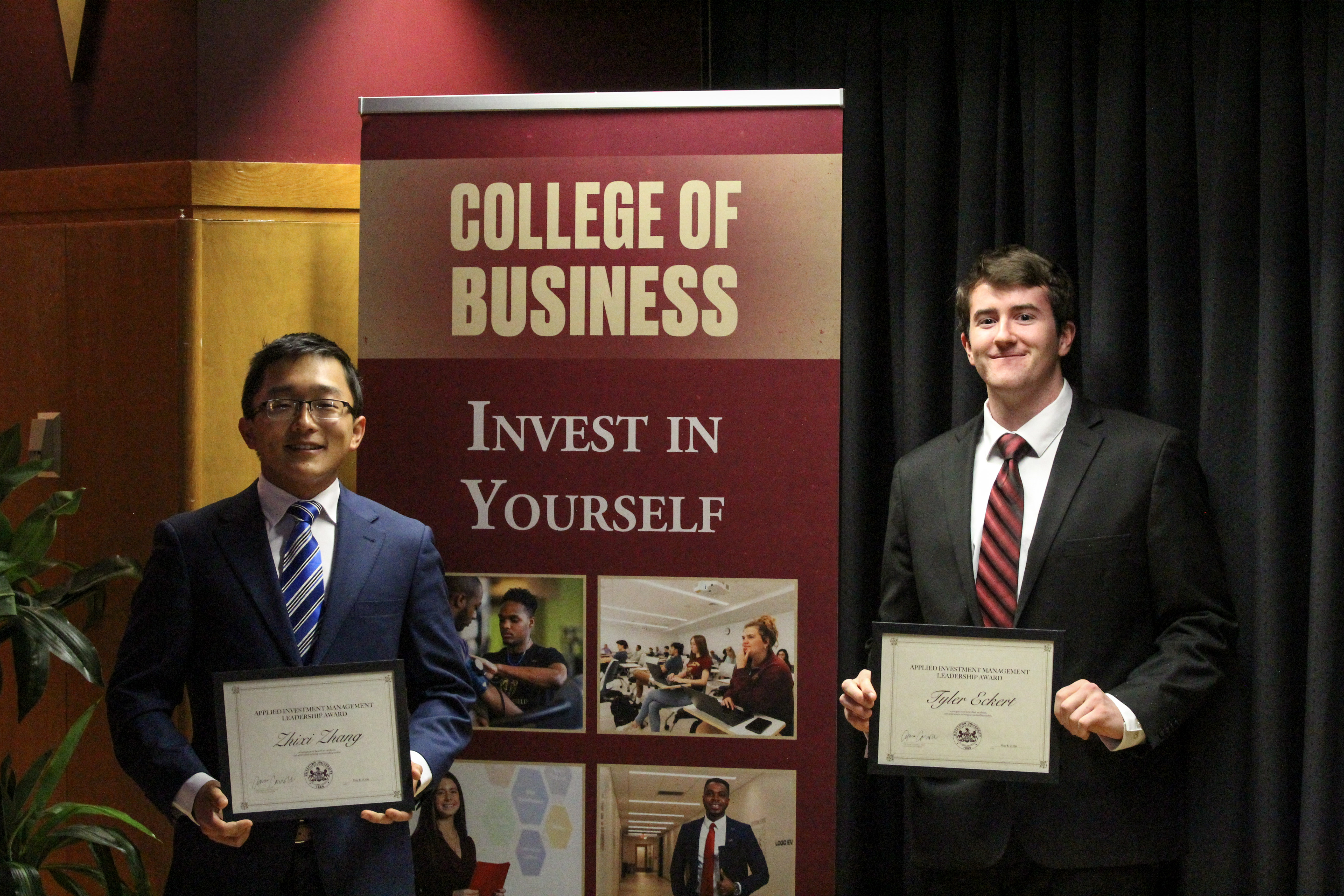 Zhixi Zhang & Tyler Eckert with award