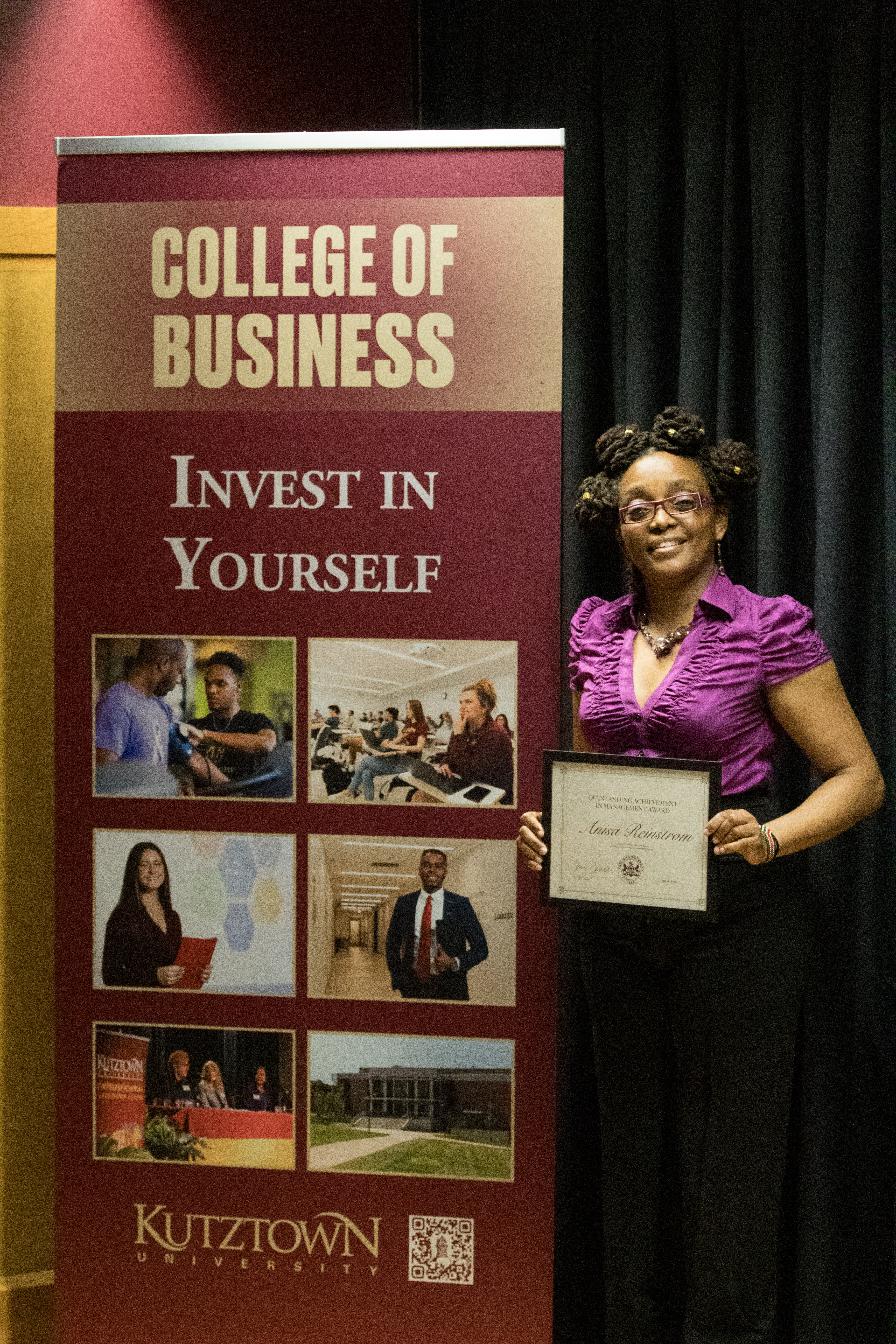 Anisa Reinstrom with award