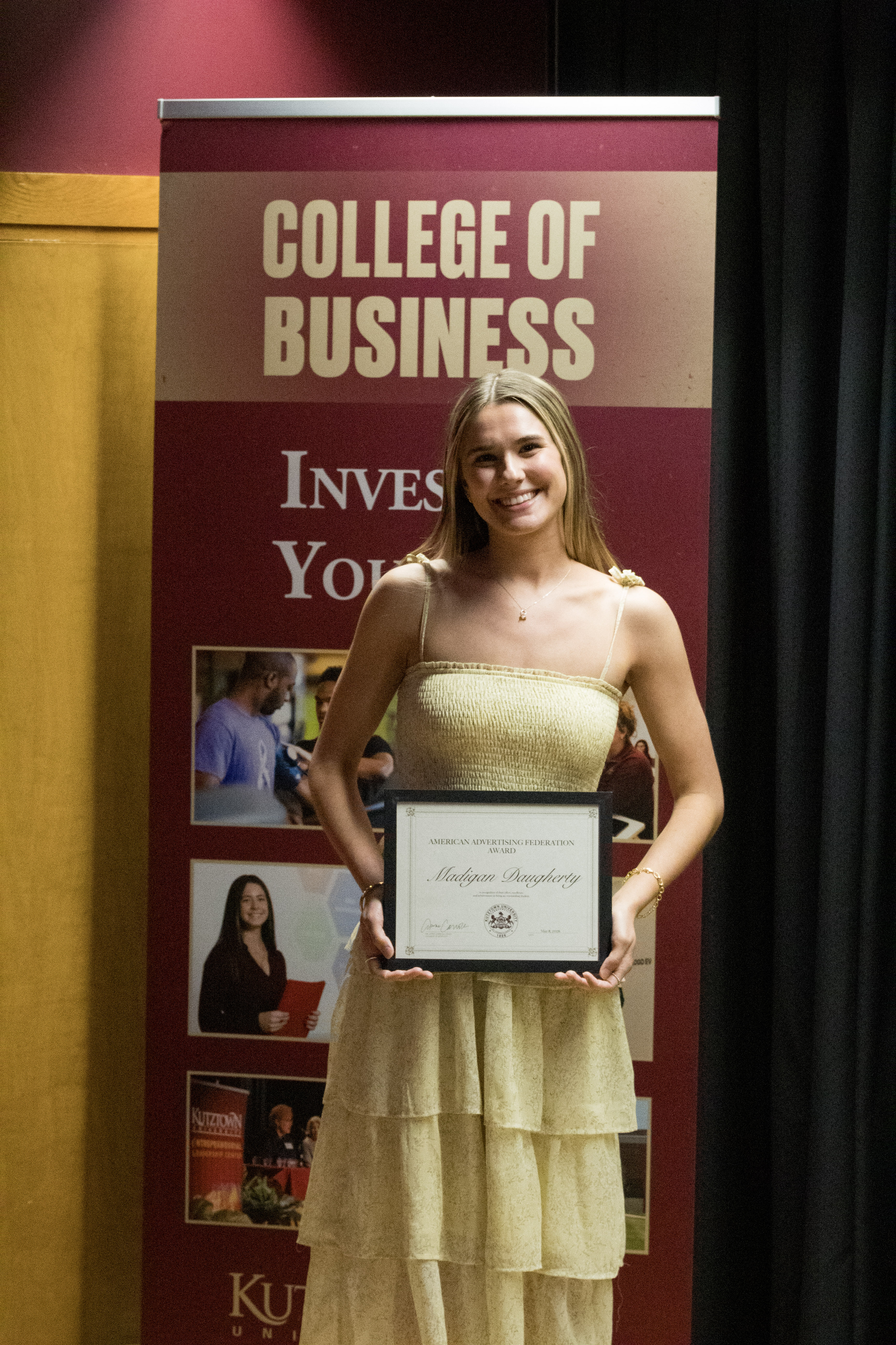 Madigan Daugherty with award