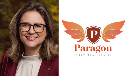 Image of Kryn McClain Keynote speaker. A white female with brown hair and glasses next to the paragon logo of wing like illustration with a capital P in the middle 
