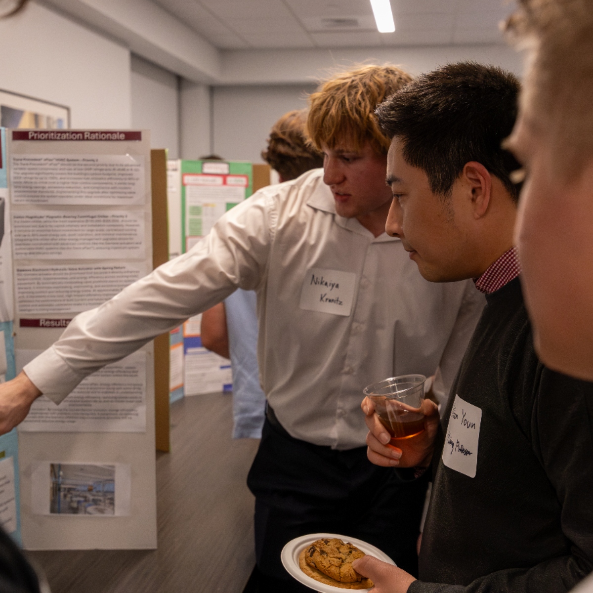 Students, Faculty members and industry professionals networking in the de Francesco lobby