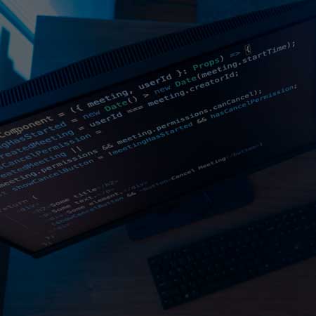 A computer monitor with code on  the screen