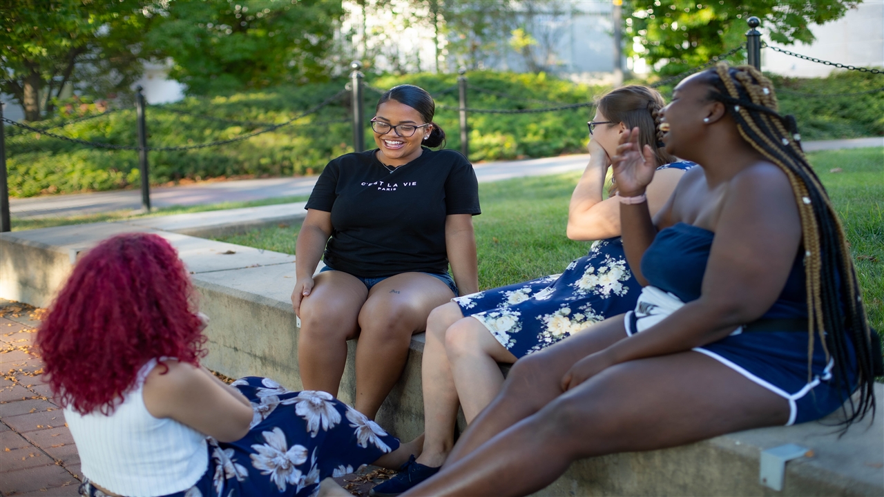 PROF students sitting outside
