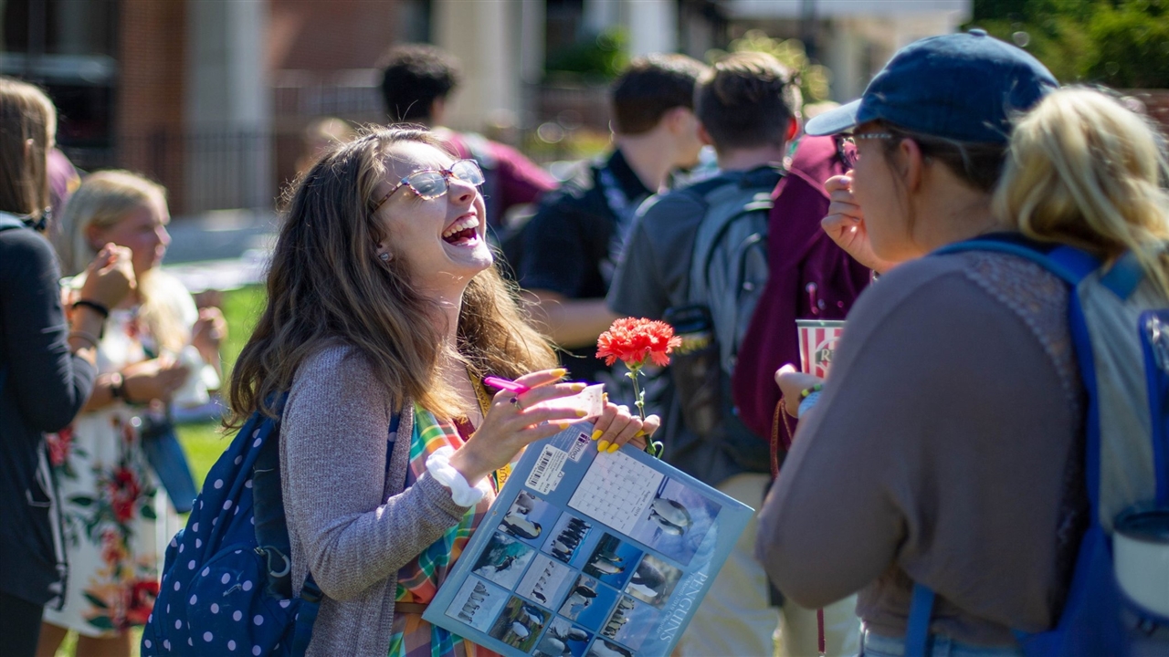 Student with flower at Unity Day