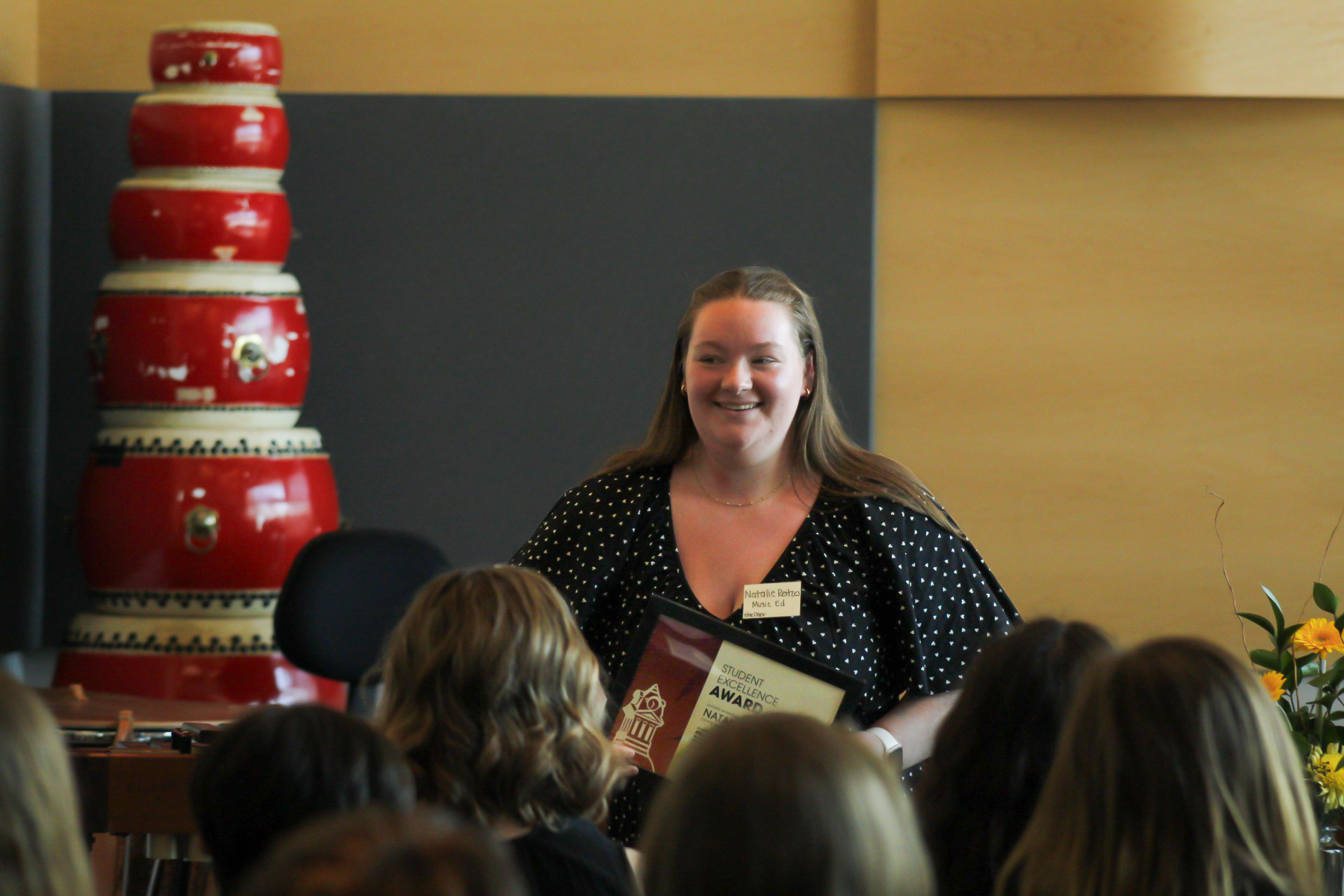 Photo of person signing Dean's List Certificate