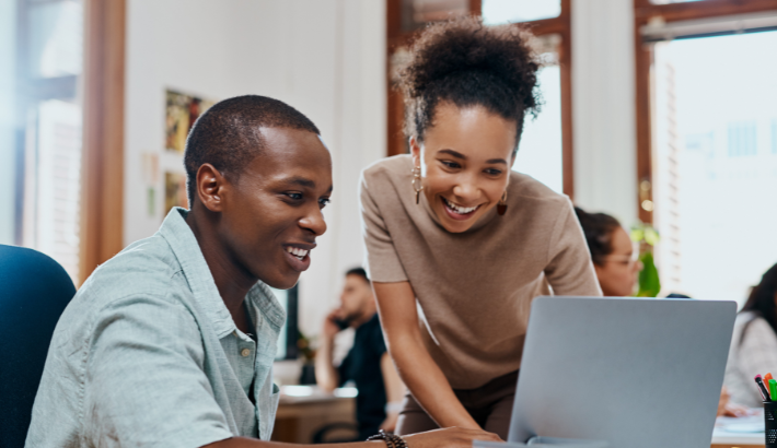 Woman and man on computer in an office