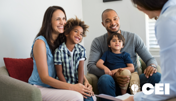 Family in counseling session with CEI logo in bottom righthand corner