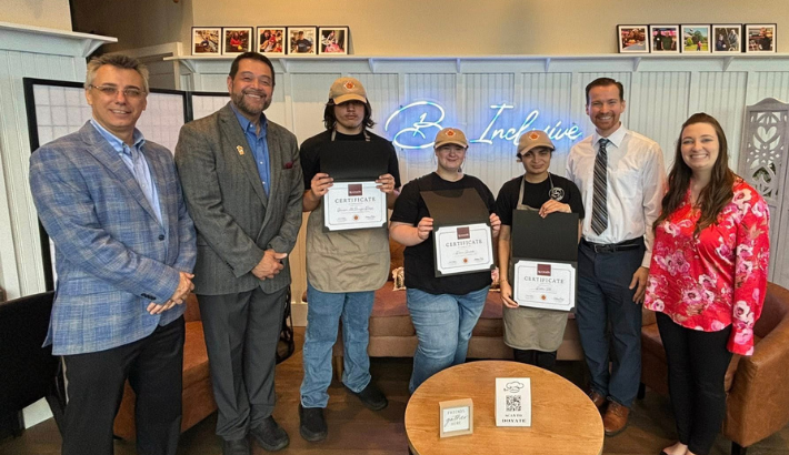 KU representatives with Coffee Inclusive Workforce Development Certificate recipients