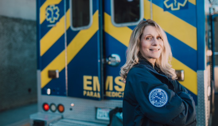 EMT standing in front of ambulance