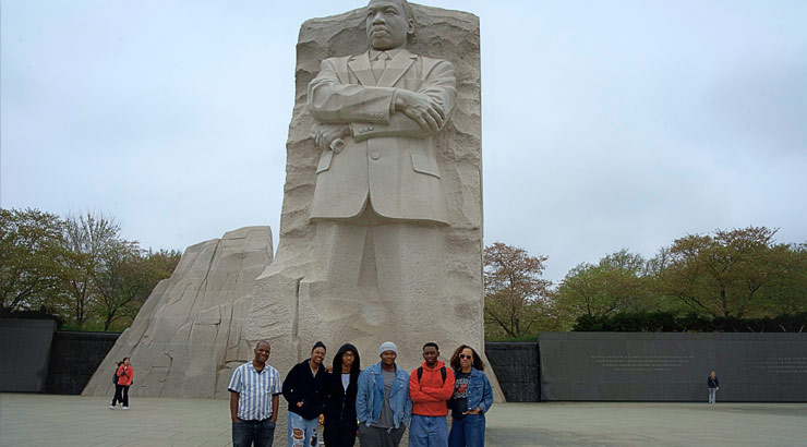 FDI students pose in front of Martin Luther King, Jr. statue.
