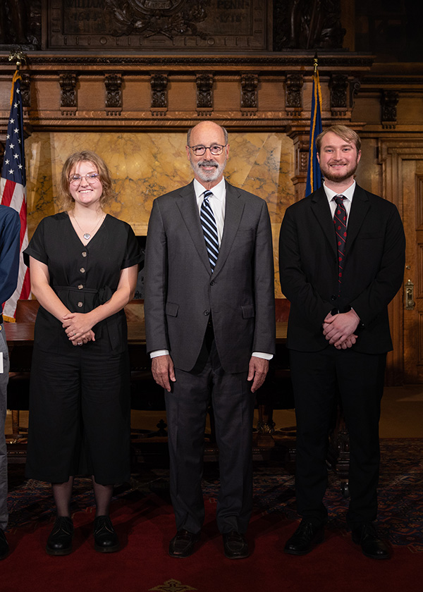Lauren Pash (left) with Governor Wolf (center) 