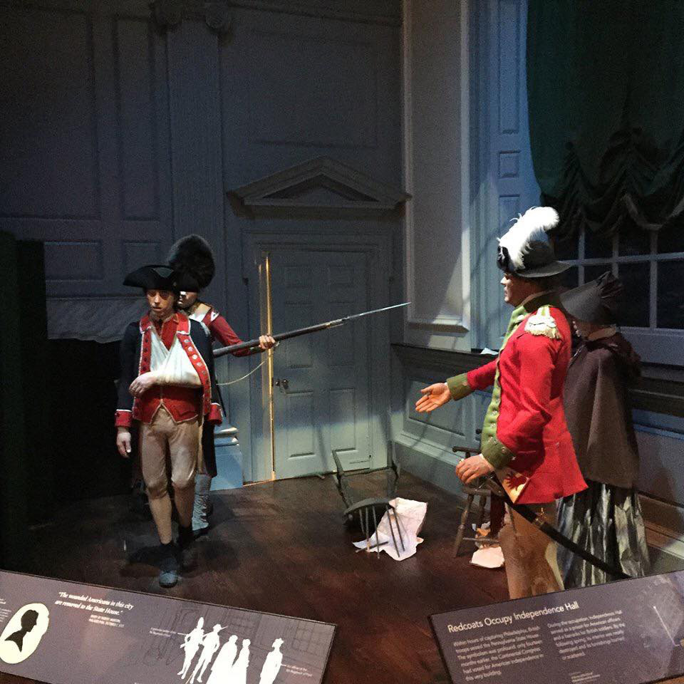 Wax figures of American Revolution soldiers going into battle in a museum exhibit