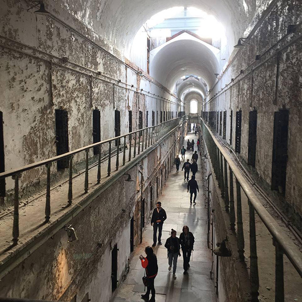 Longer view of double decker hallway at Eastern State Penitentiary, taken from an upper balcony
