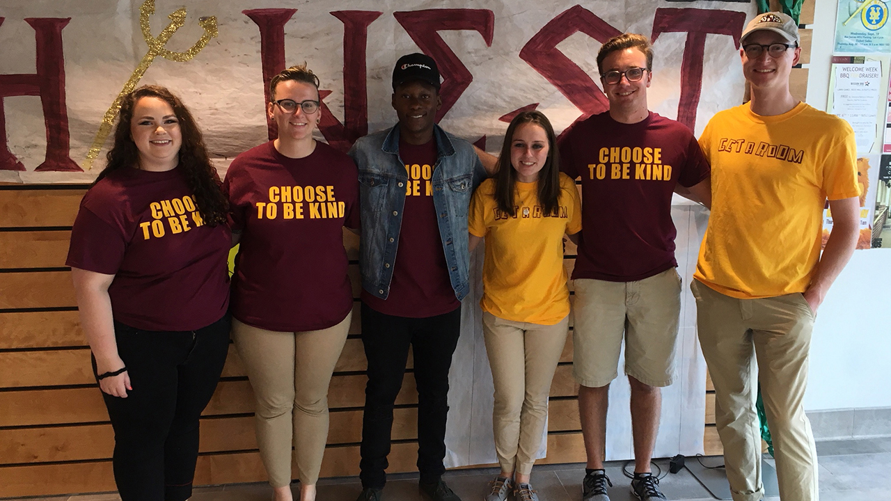 CAs pose together in Rothermel lobby during move in day