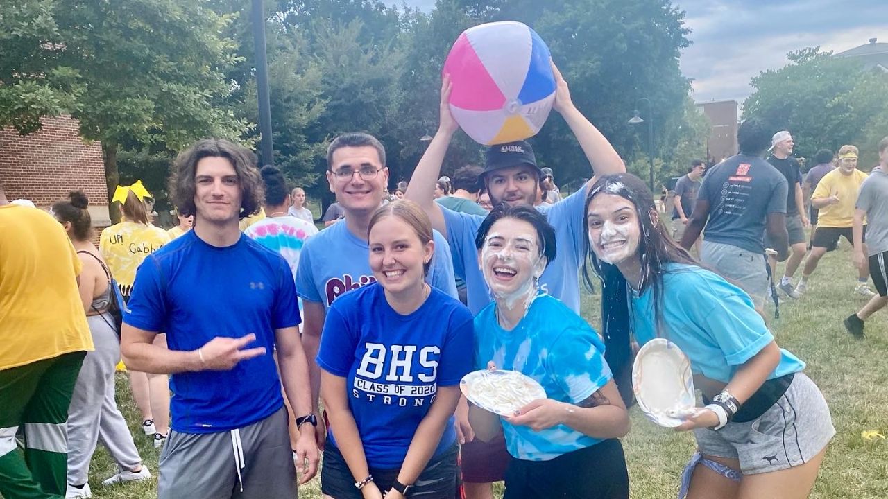 Bonner Staff pose with beach ball and pied faces on DMZ