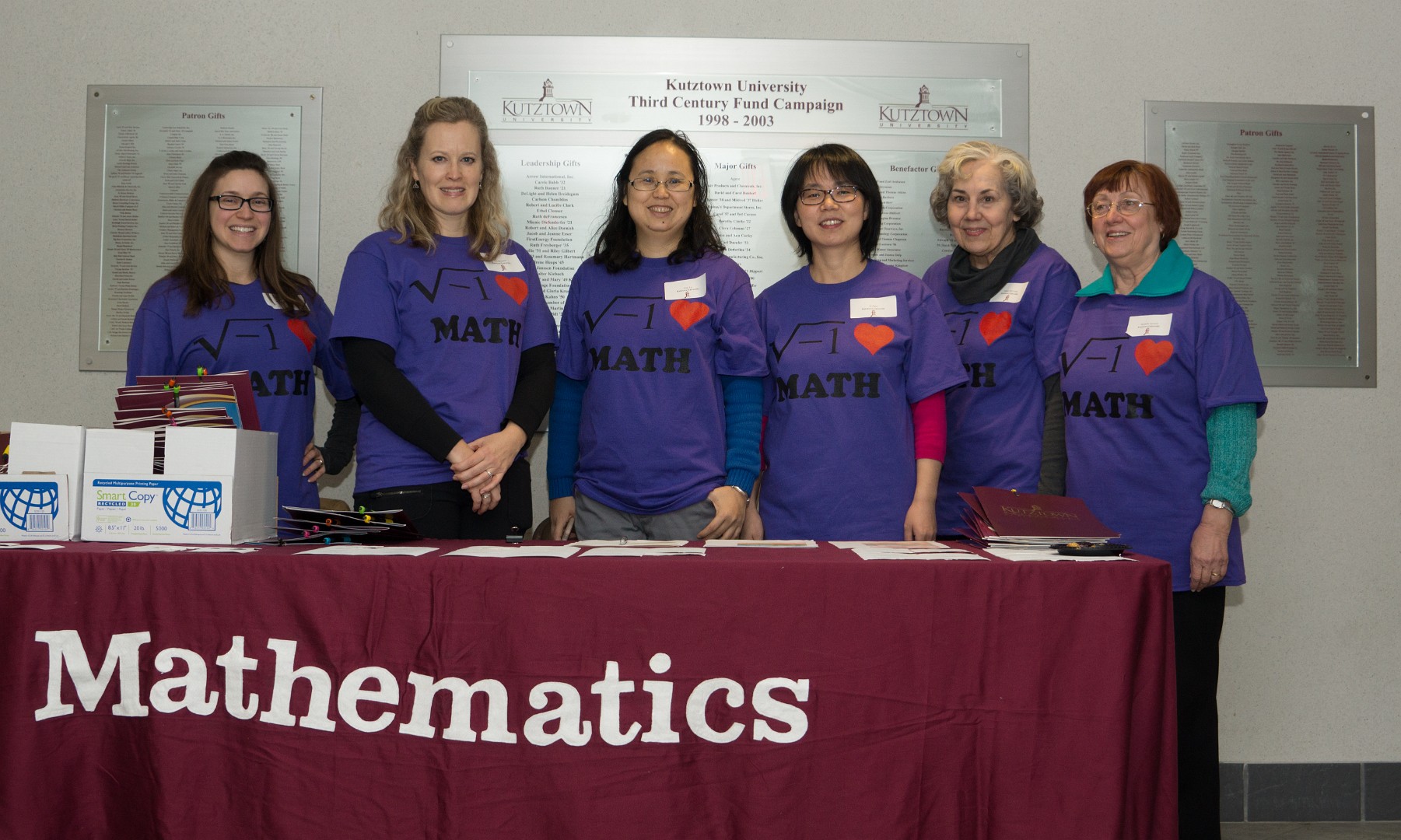 HS Math Day organizers standing at a recruitment table