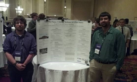 Students presenting their poster at a conference
