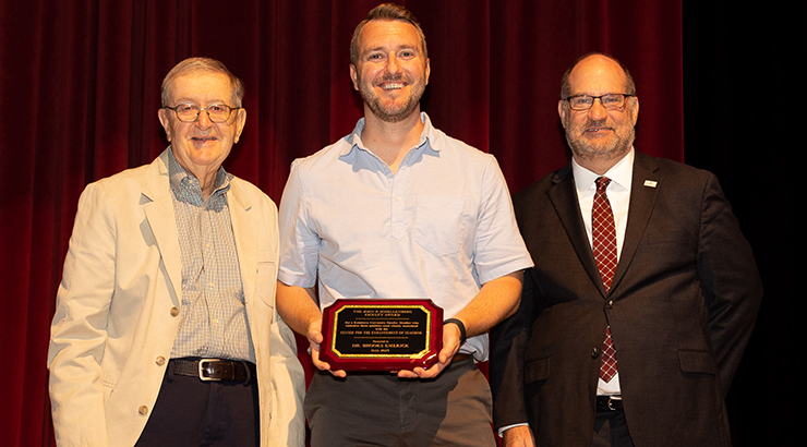 Dr. Emerick winning the Schellenberg Award