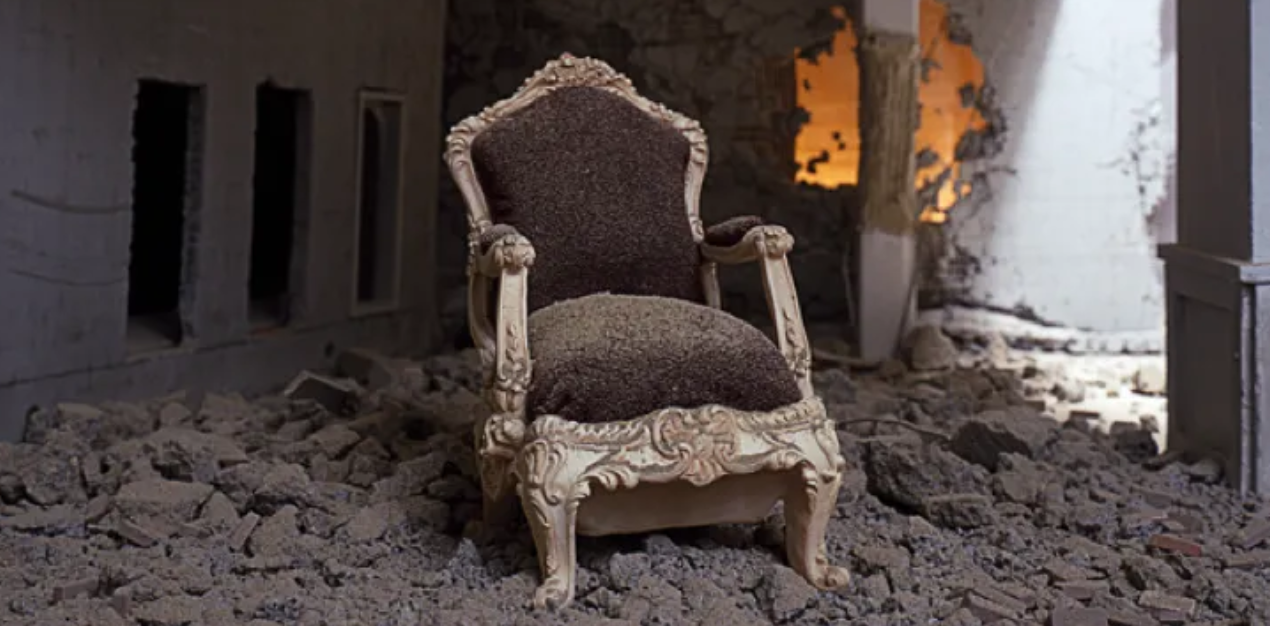 painting of a lavish throne-like chair in an abandoned stone building, sitting atop a pile of rubble 