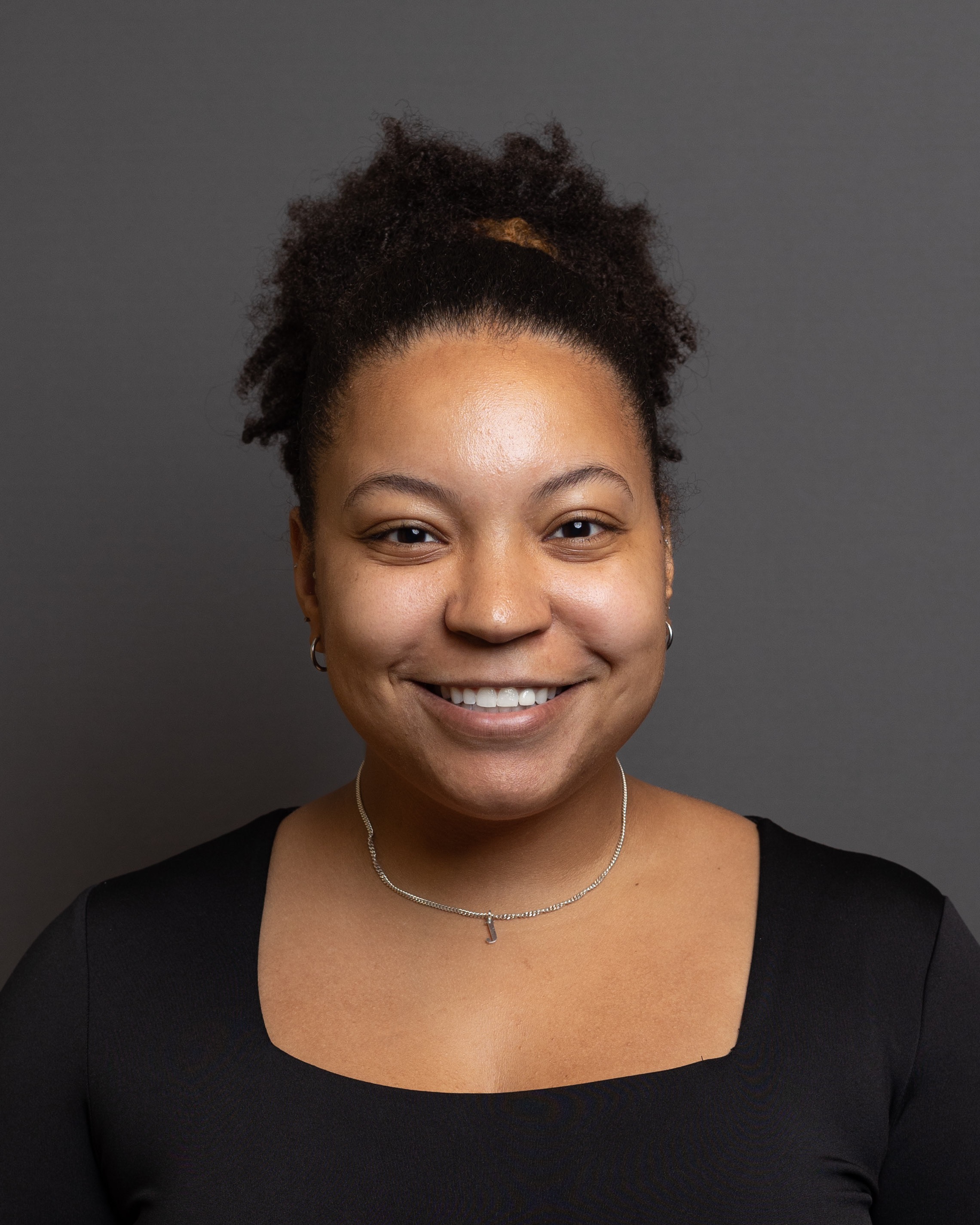 woman smiling wearing black shirt