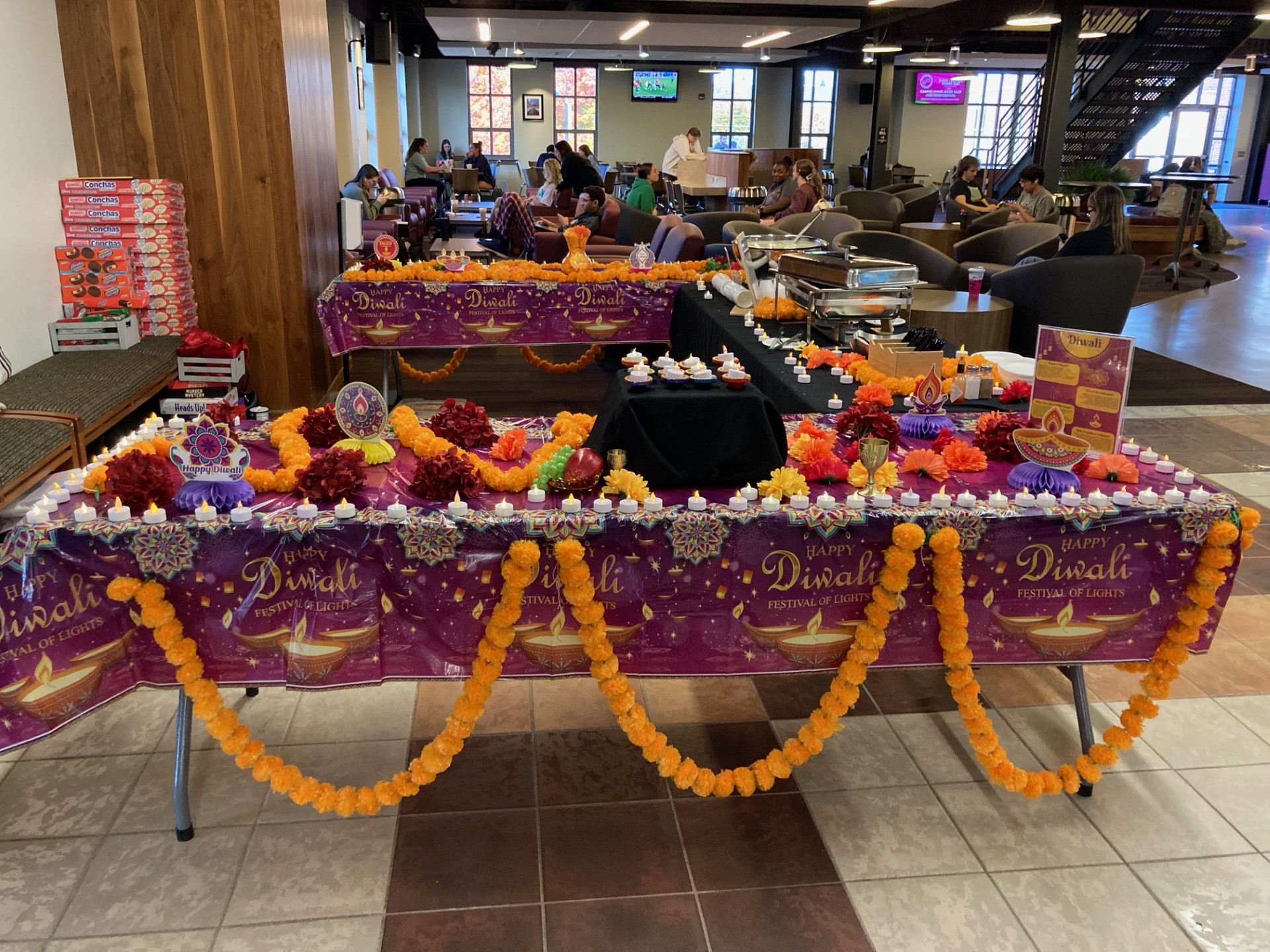 Table decorated in purple and yellow for Diwali Celebration.