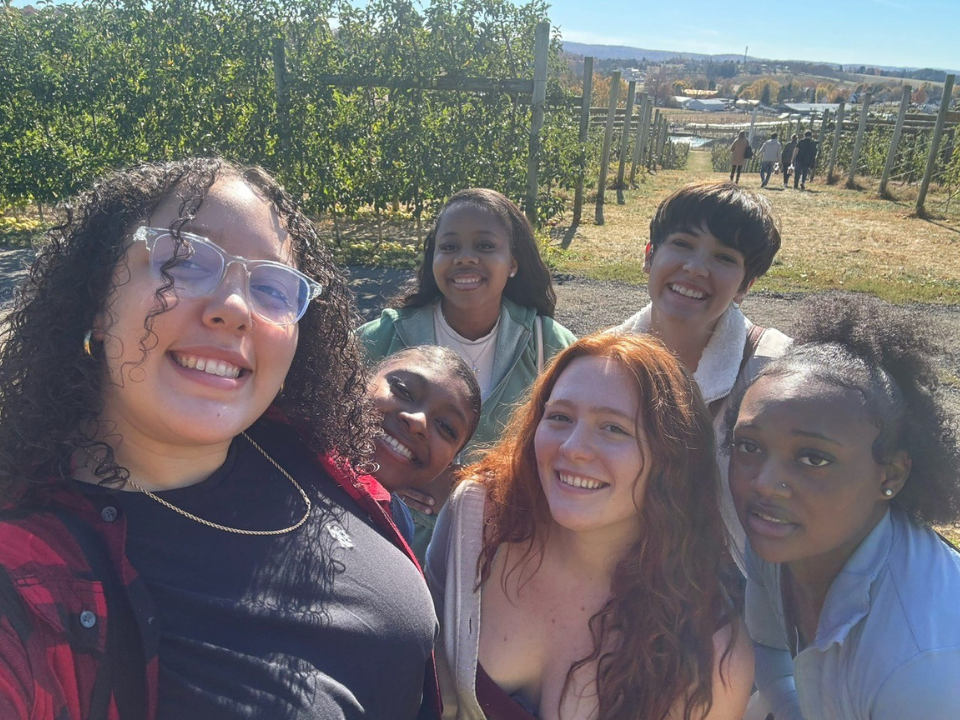 Group of 6 students in SISTERs program going apple picking.