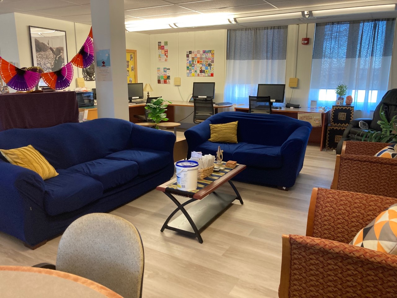  Interior of the resource room in the Multicultural Center featuring two blue couches 
