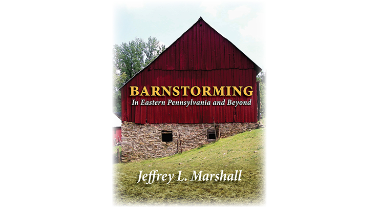A red barn gable in sloping landscape with text "Barnstorming in Eastern Pennsylvania" across the barn.