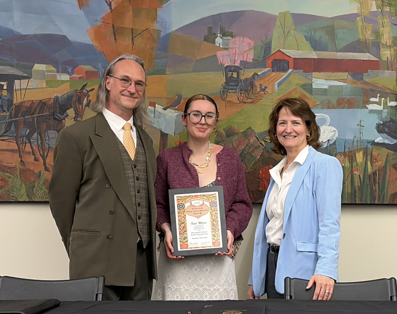 KU Student Receives scholarship certificate