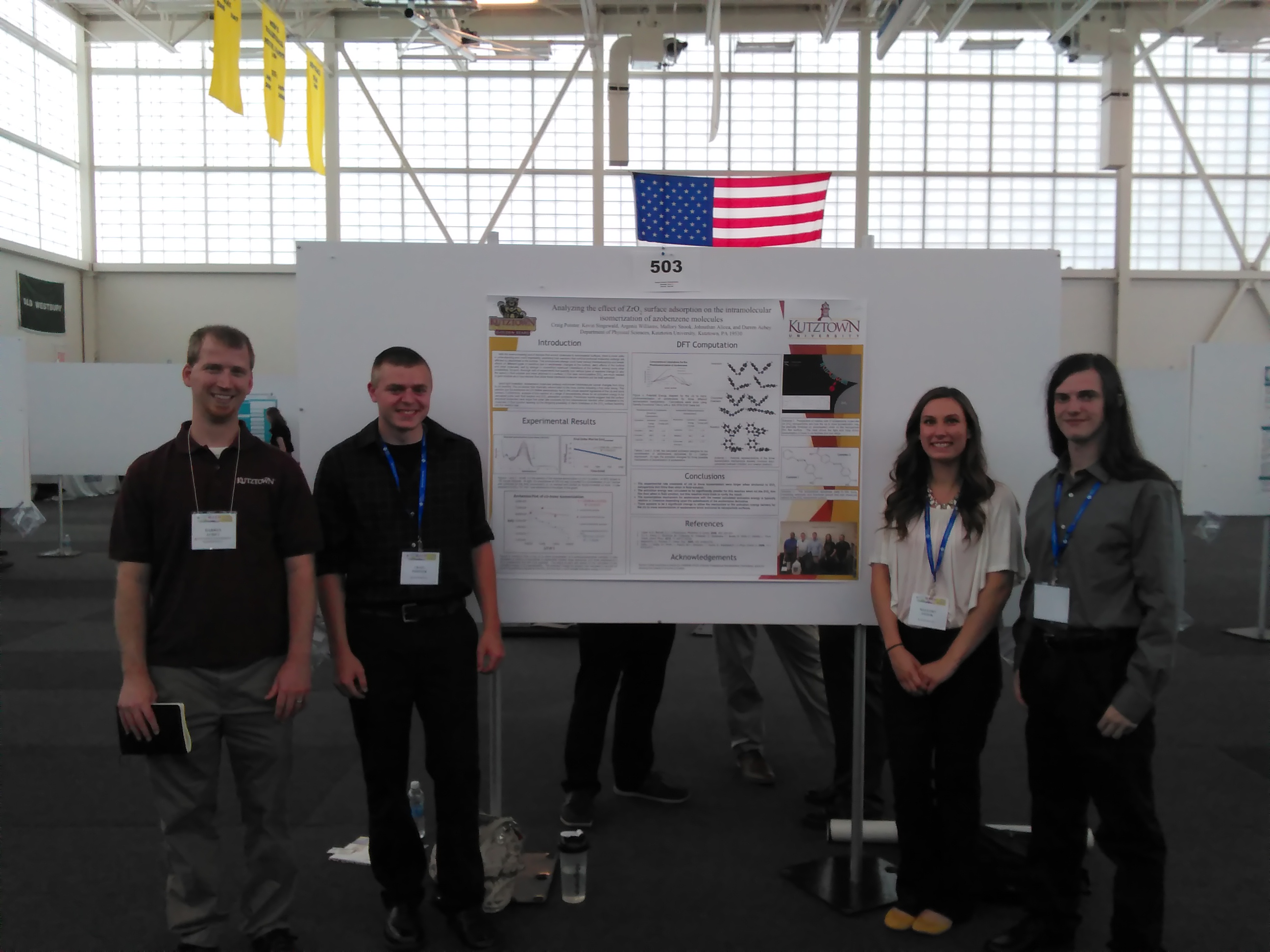 picture of achey research group presenting poster