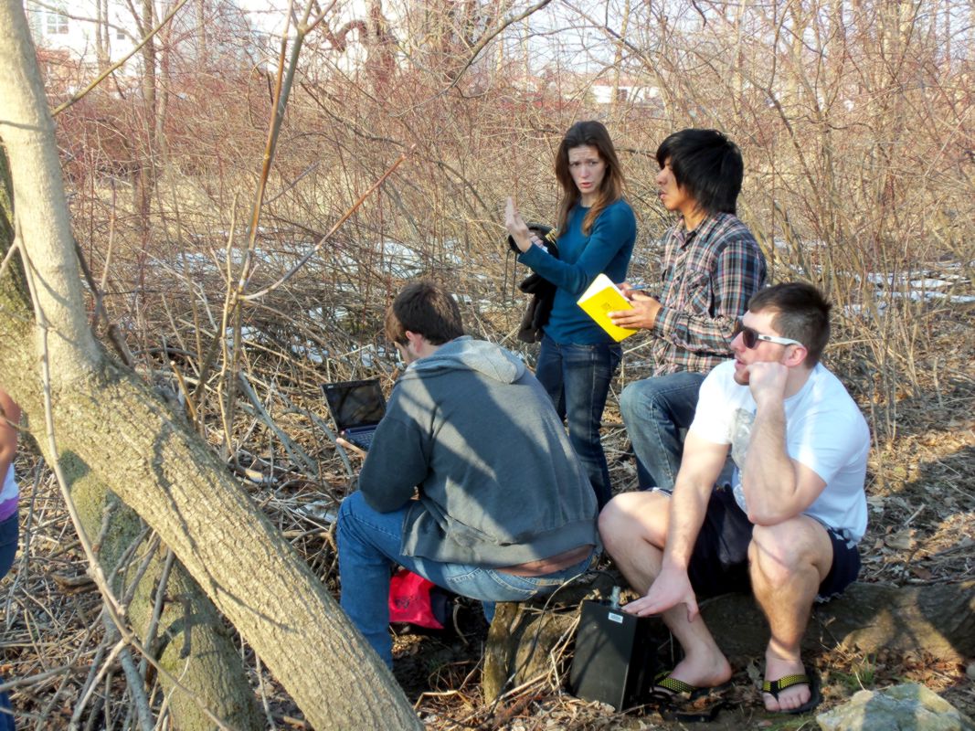 Dr. Sherrod lecturing to class in a forest