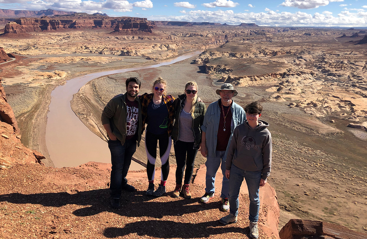 Dr. Ed Simpson and students in Utah with landscape in the background