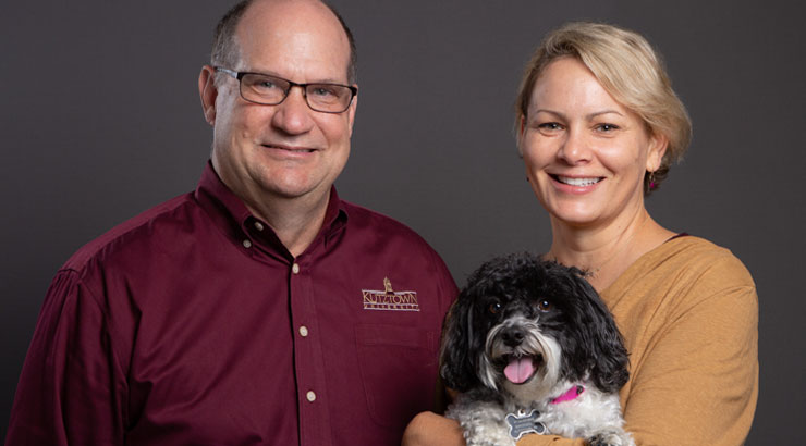 President and Mrs. Hawkinson, with Wynnie, the first dog of KU