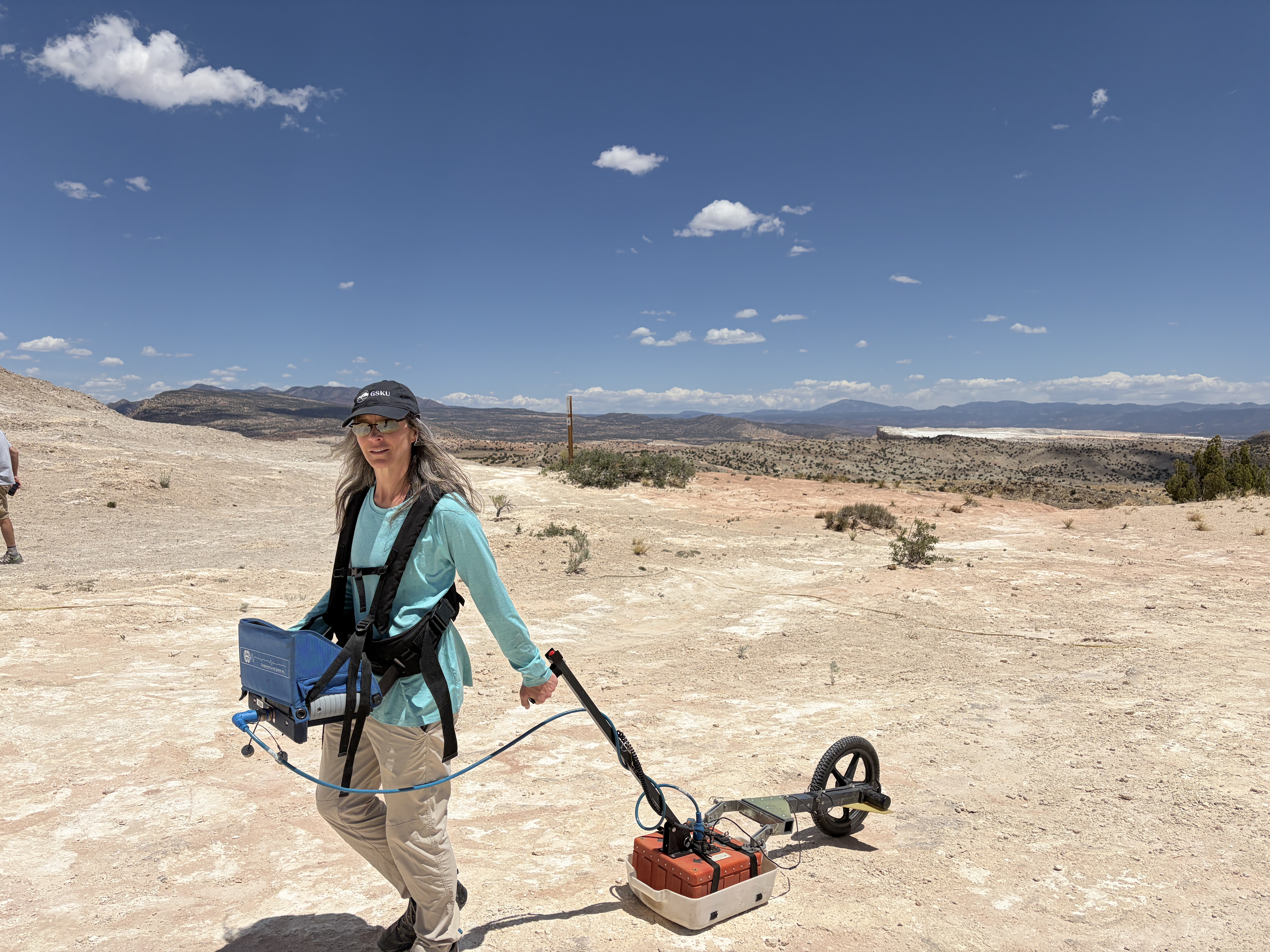 Dr. Sherrod on a summer day in New Mexico pulling the Ground Penetrating Radar.