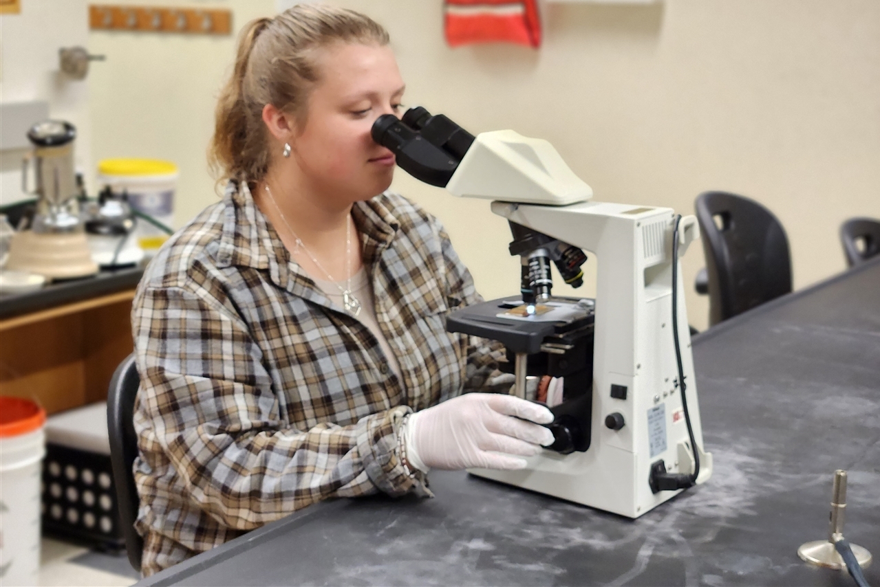Theresa Coleman working in a lab.
