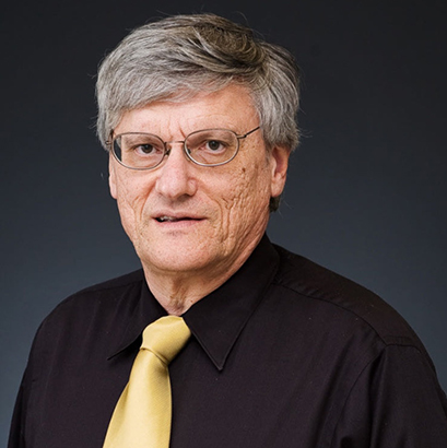 Image of Dr. Stephen M. Marson in front dark gray background