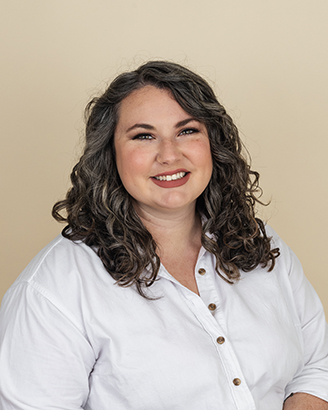 Image of Emily Snisky in white blouse in front of beige background