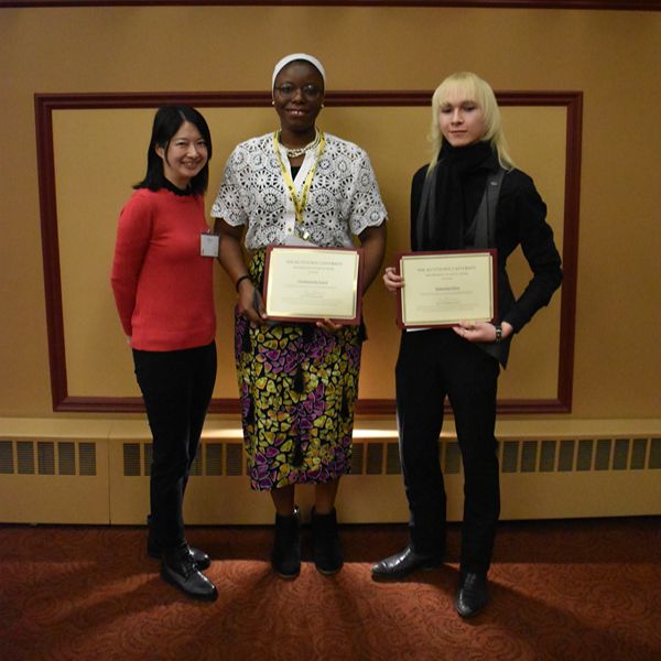 Dr. FangHsun Wei (left) standing with student diversity prize winners