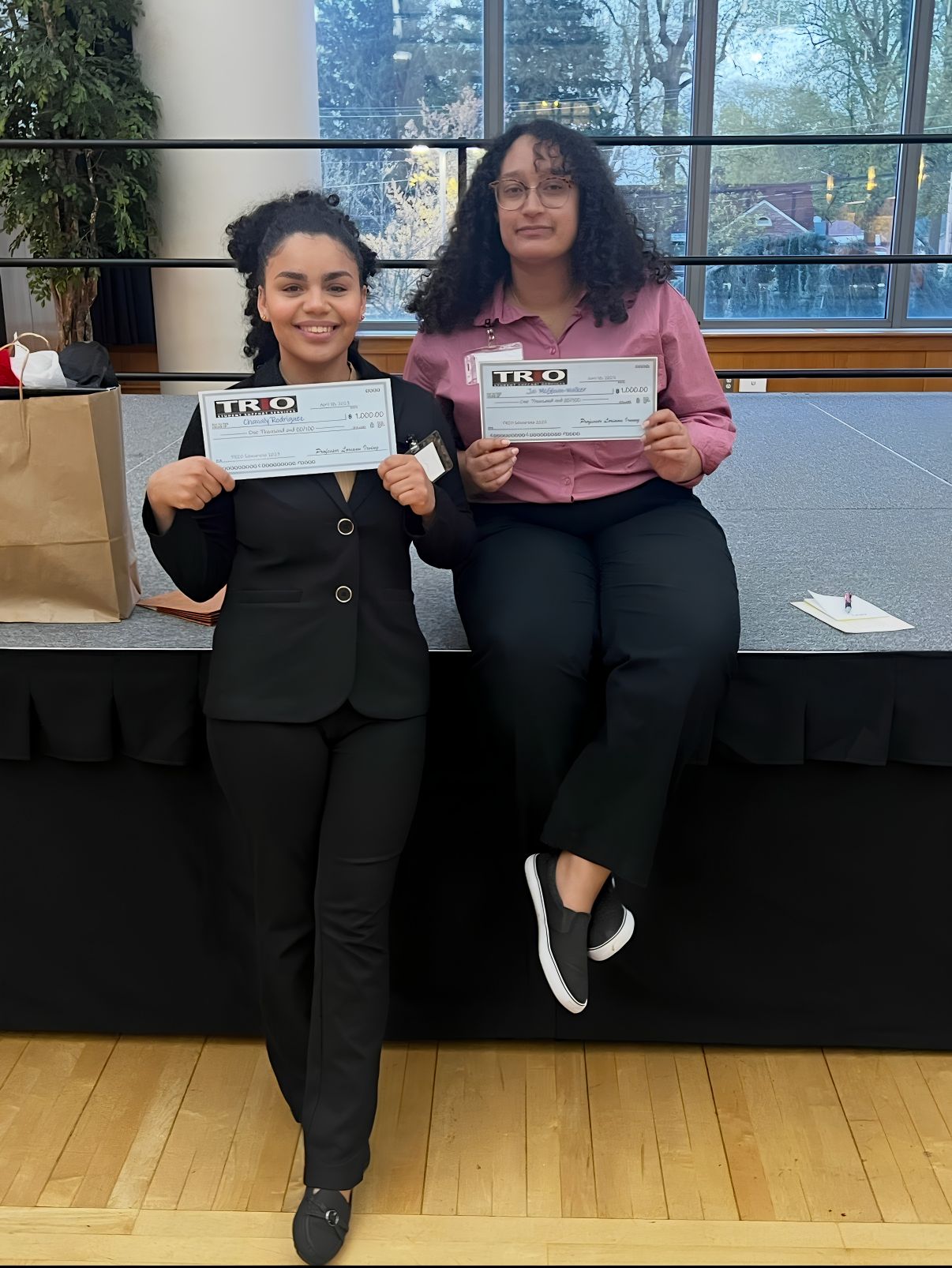 Two students pose for a photo after being awarded.