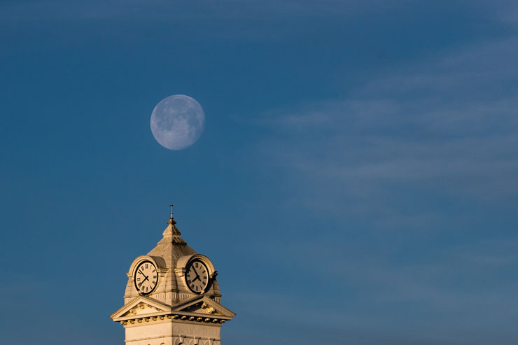Moon rising over KU Clock Tower 