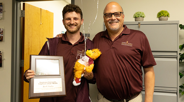 Santos accepting awards from Cavalier