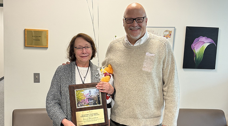Brynildsen accepting awards from Cavalier